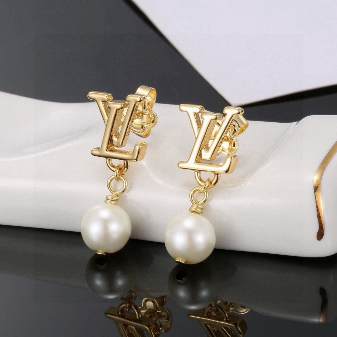 Martin Graham stud earrings in polished metal-tone – front product view