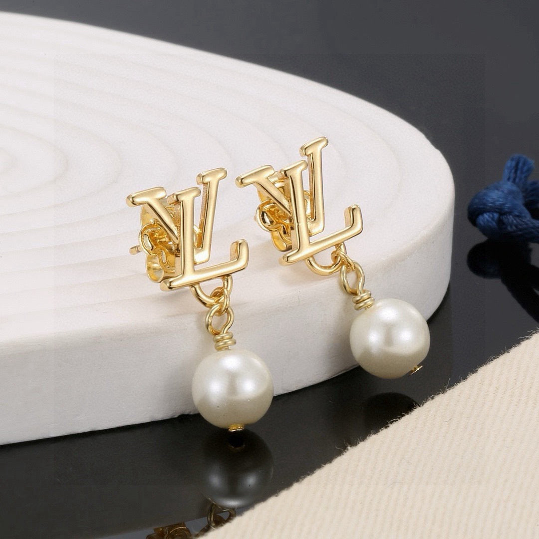 Martin Graham stud earrings in polished metal-tone – front product view