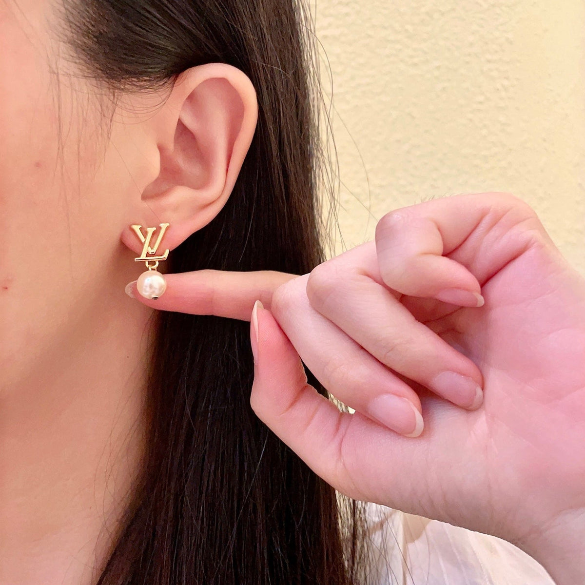 Martin Graham stud earrings in polished metal-tone – styled product view