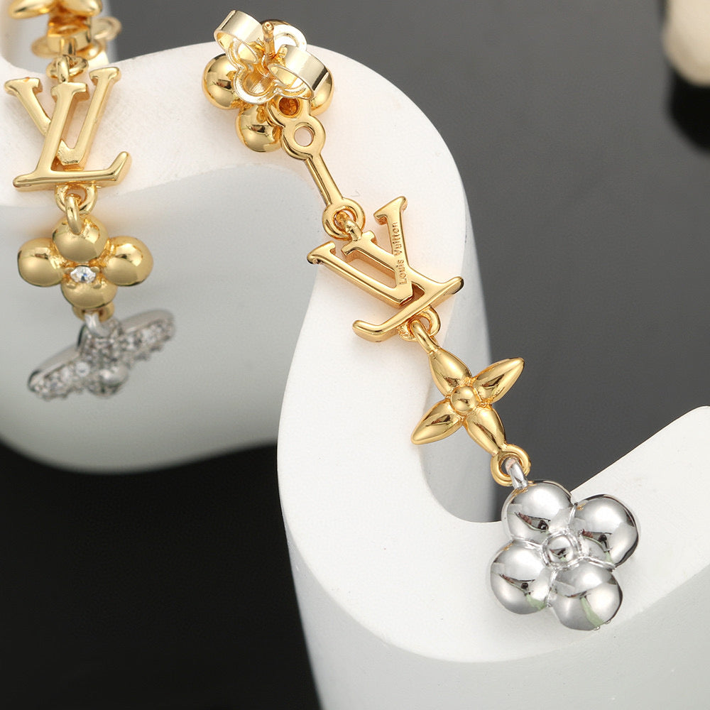 Martin Graham stud earrings in polished metal-tone – detail view