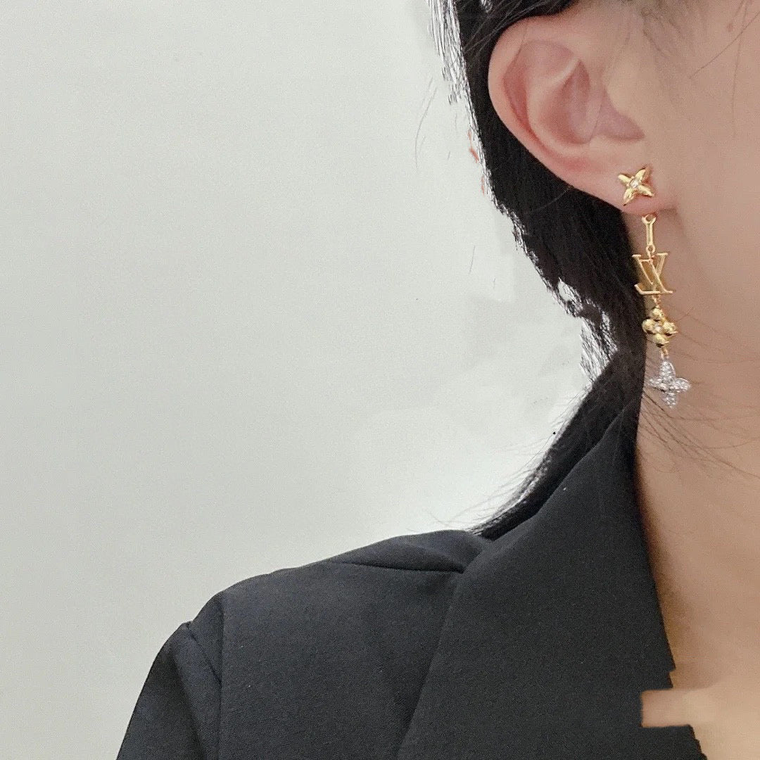 Martin Graham stud earrings in polished metal-tone – close-up detail