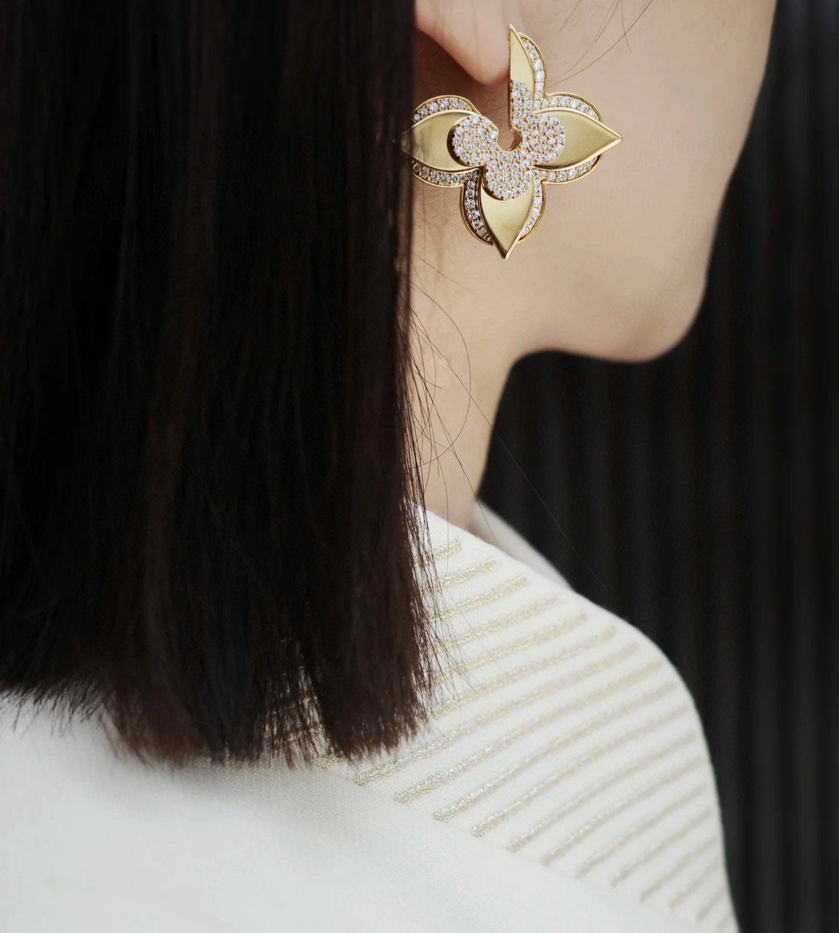 Martin Graham stud earrings in polished metal-tone – side detail