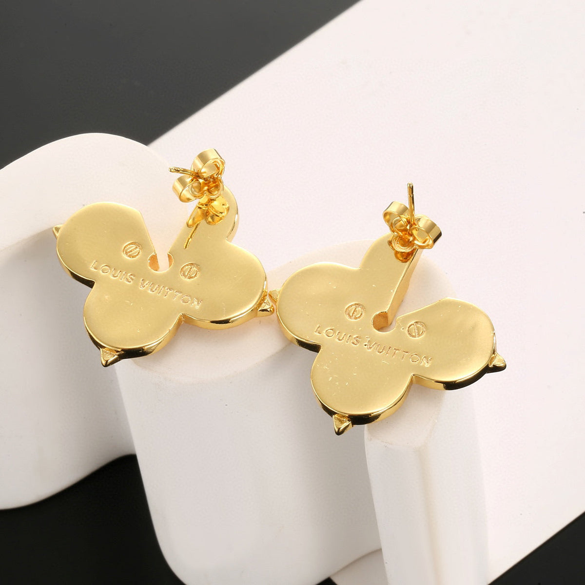 Martin Graham stud earrings in polished metal-tone – styled product view
