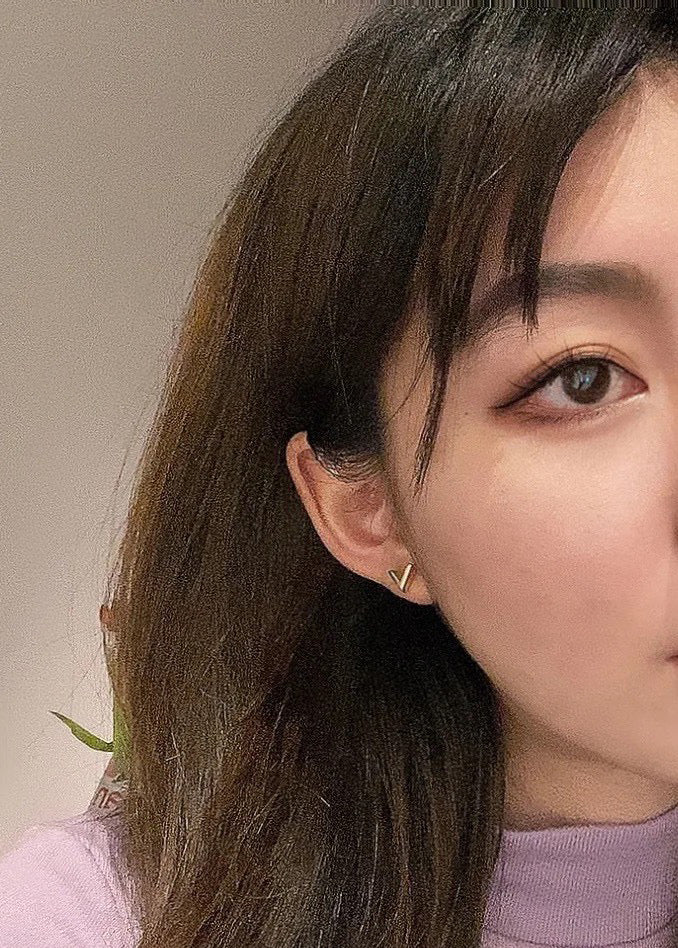 Martin Graham stud earrings in polished metal-tone – close-up detail