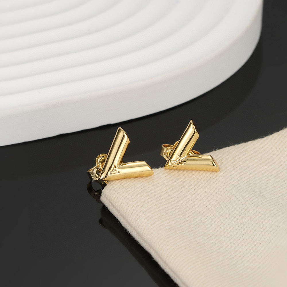 Martin Graham stud earrings in polished metal-tone – styled product view