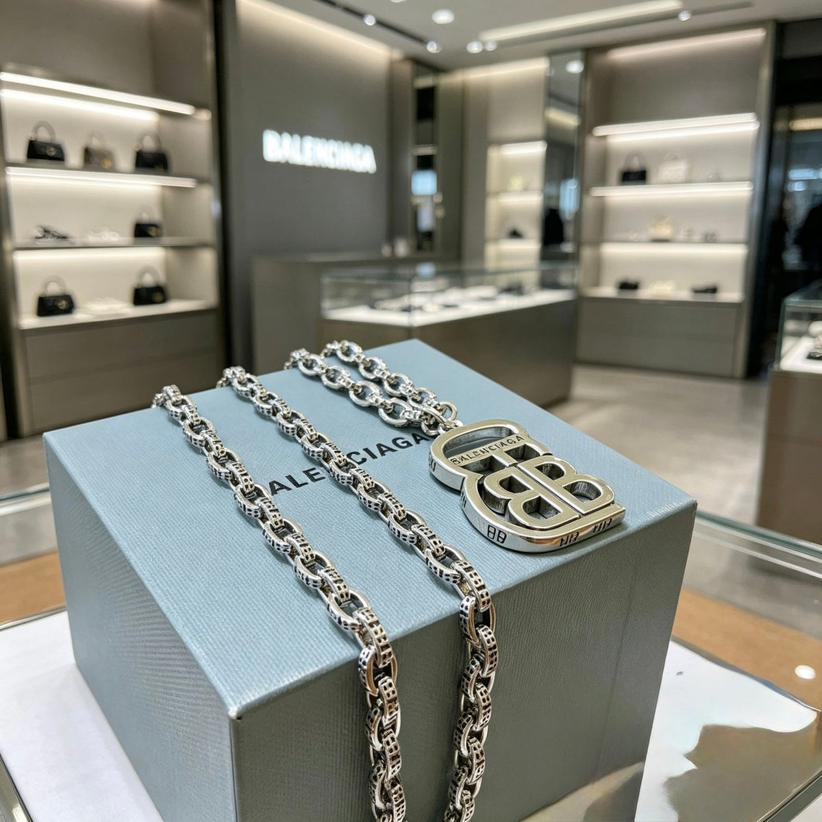 Martin Graham pendant necklace in polished metal-tone – close-up detail