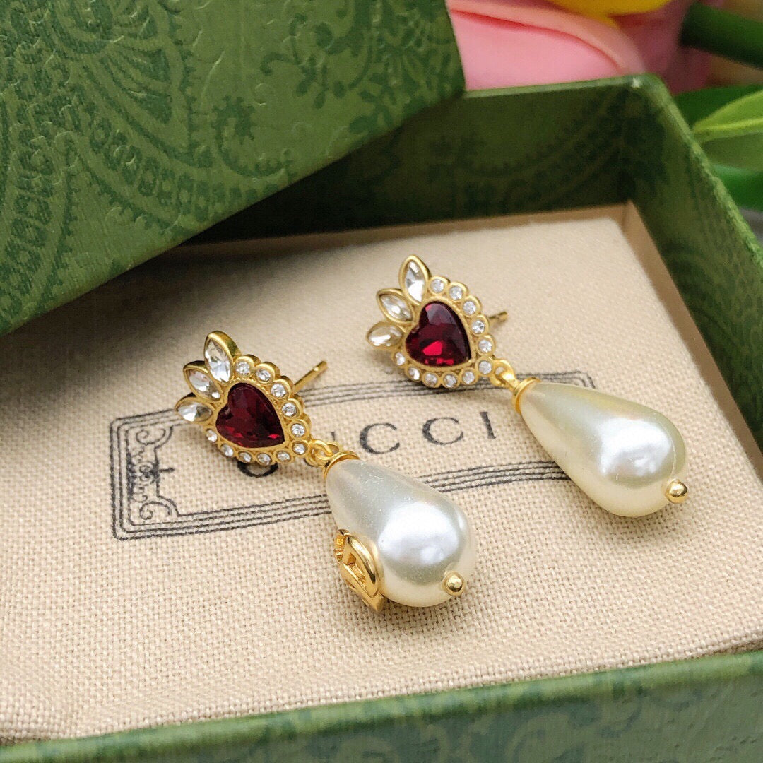 Martin Graham earrings in polished metal-tone – close-up detail