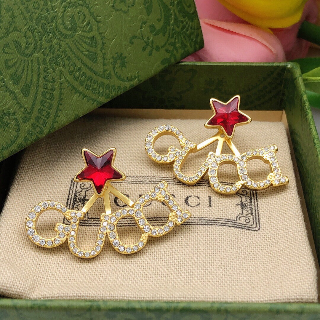 Martin Graham earrings in polished metal-tone – close-up detail