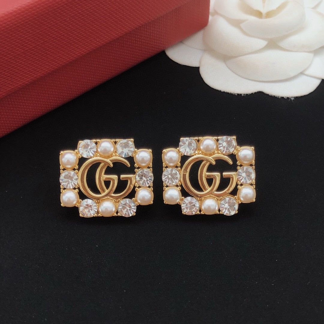 Martin Graham stud earrings in polished metal-tone – main product view