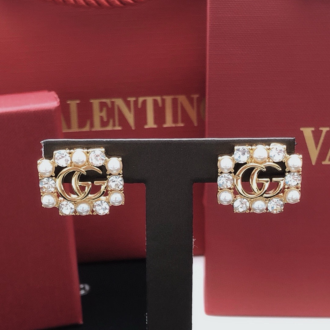 Martin Graham stud earrings in polished metal-tone – front product view