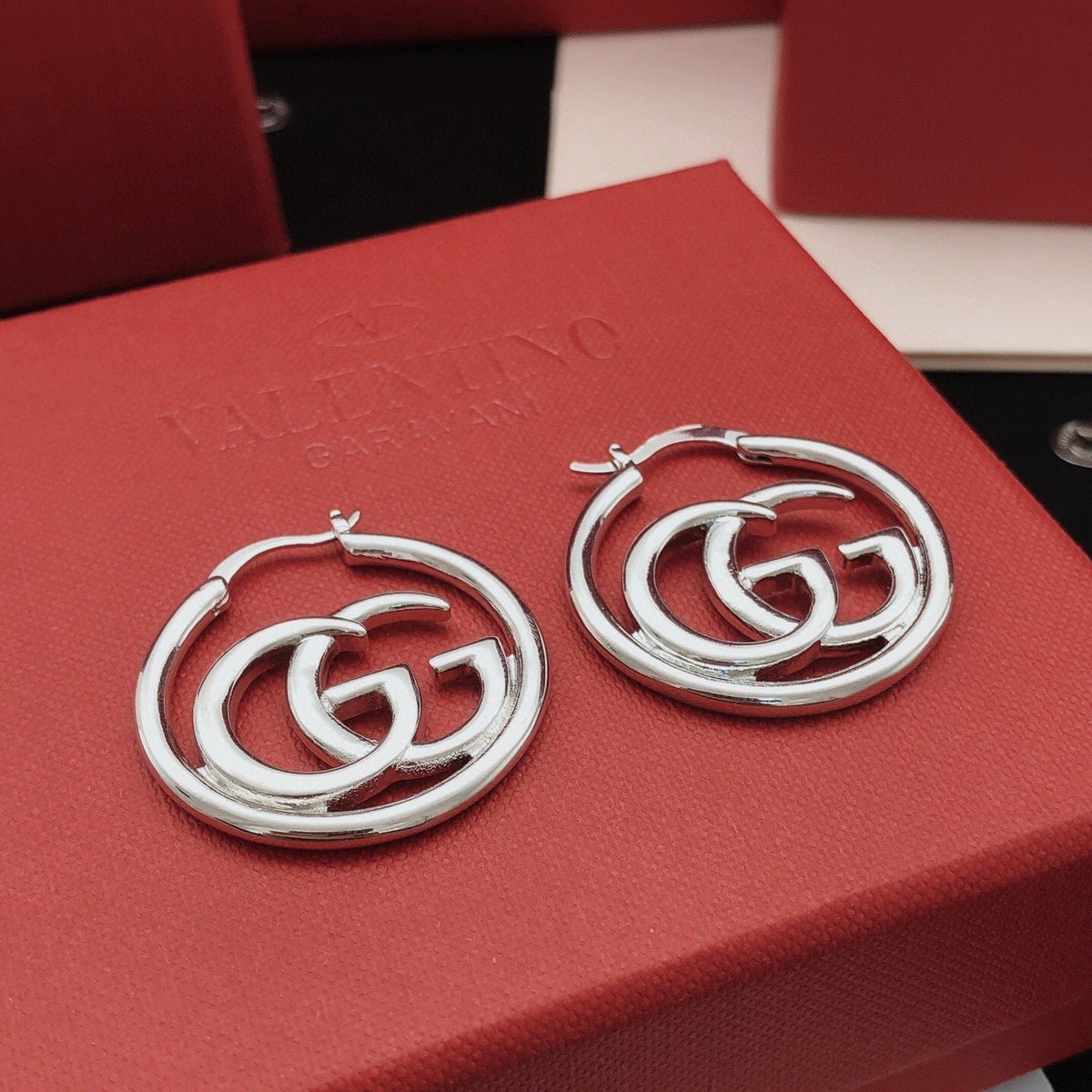 Martin Graham stud earrings in polished metal-tone – detail view