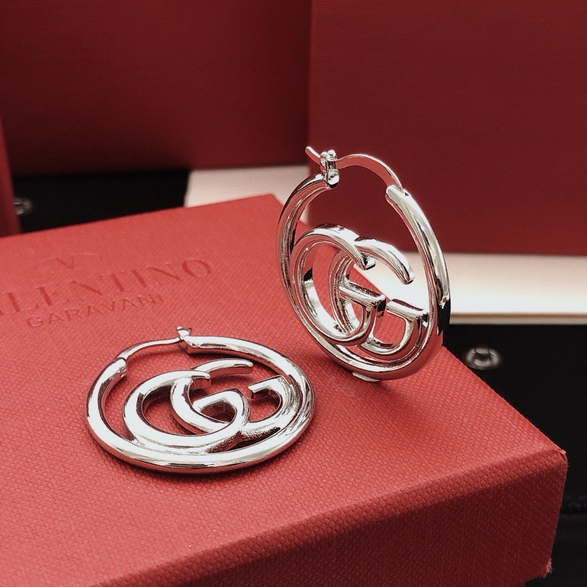 Martin Graham stud earrings in polished metal-tone – front product view