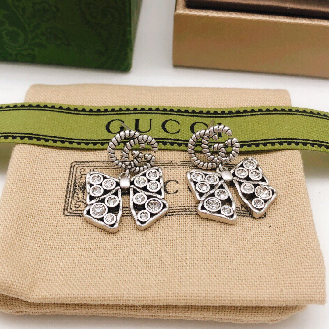 Martin Graham earrings in polished metal-tone – front product view