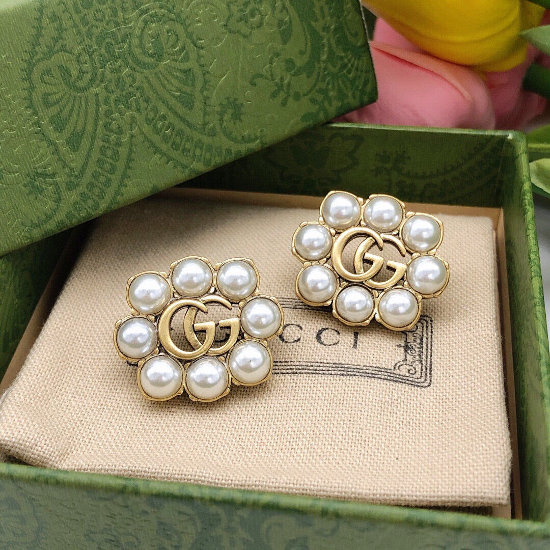 Martin Graham stud earrings in polished metal-tone – side detail