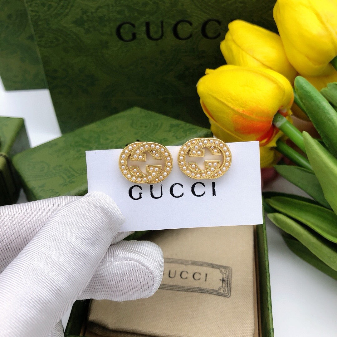 Martin Graham stud earrings in polished metal-tone – front product view