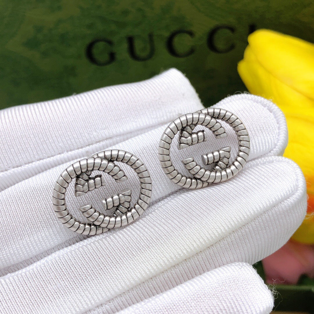 Martin Graham stud earrings in polished metal-tone – main product view