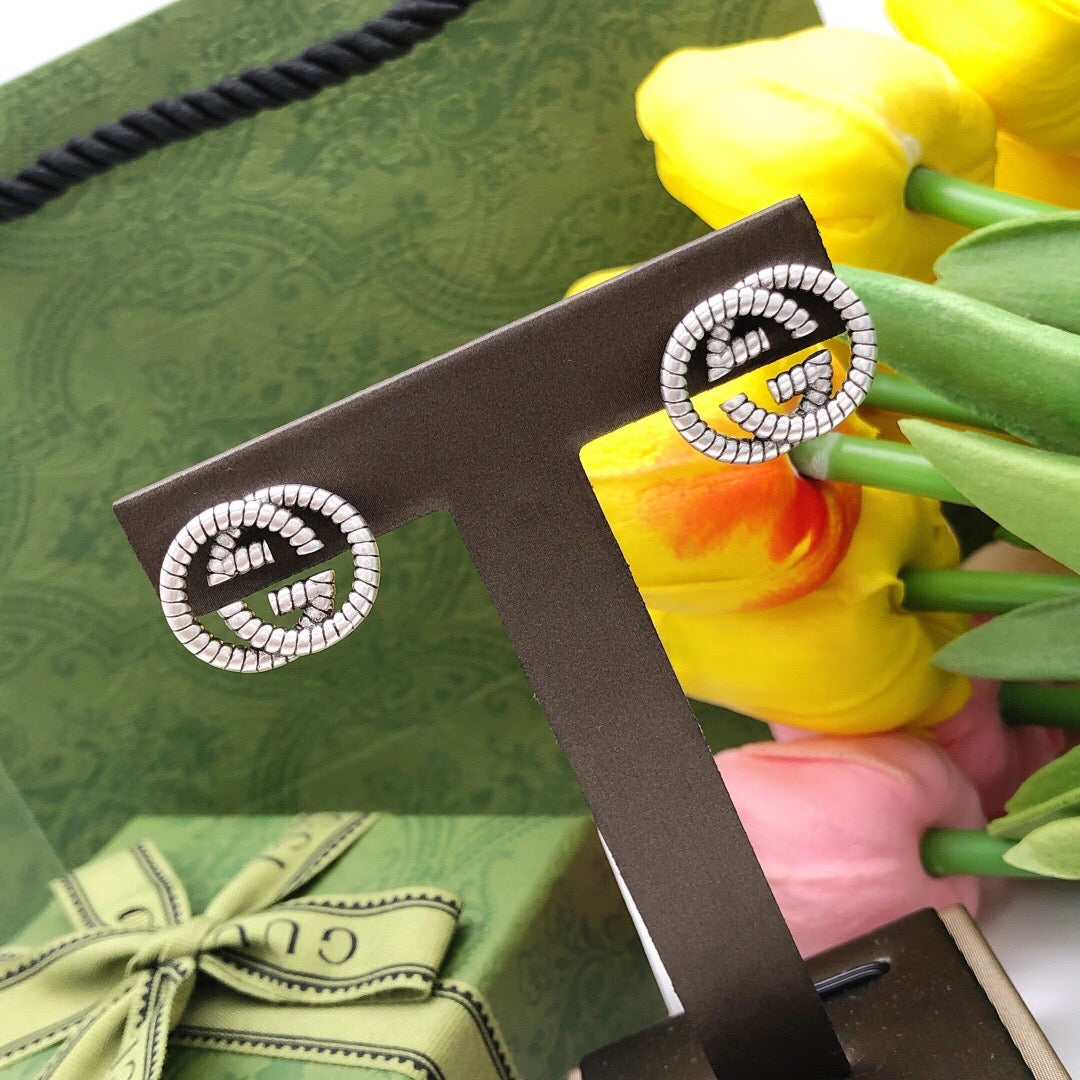 Martin Graham stud earrings in polished metal-tone – main product view