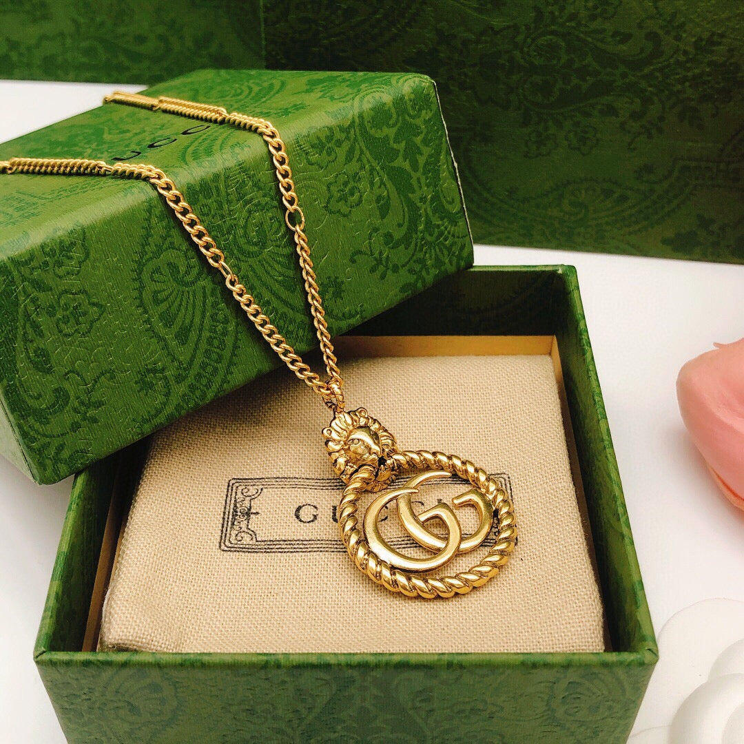 Martin Graham pendant necklace in polished metal-tone – close-up detail