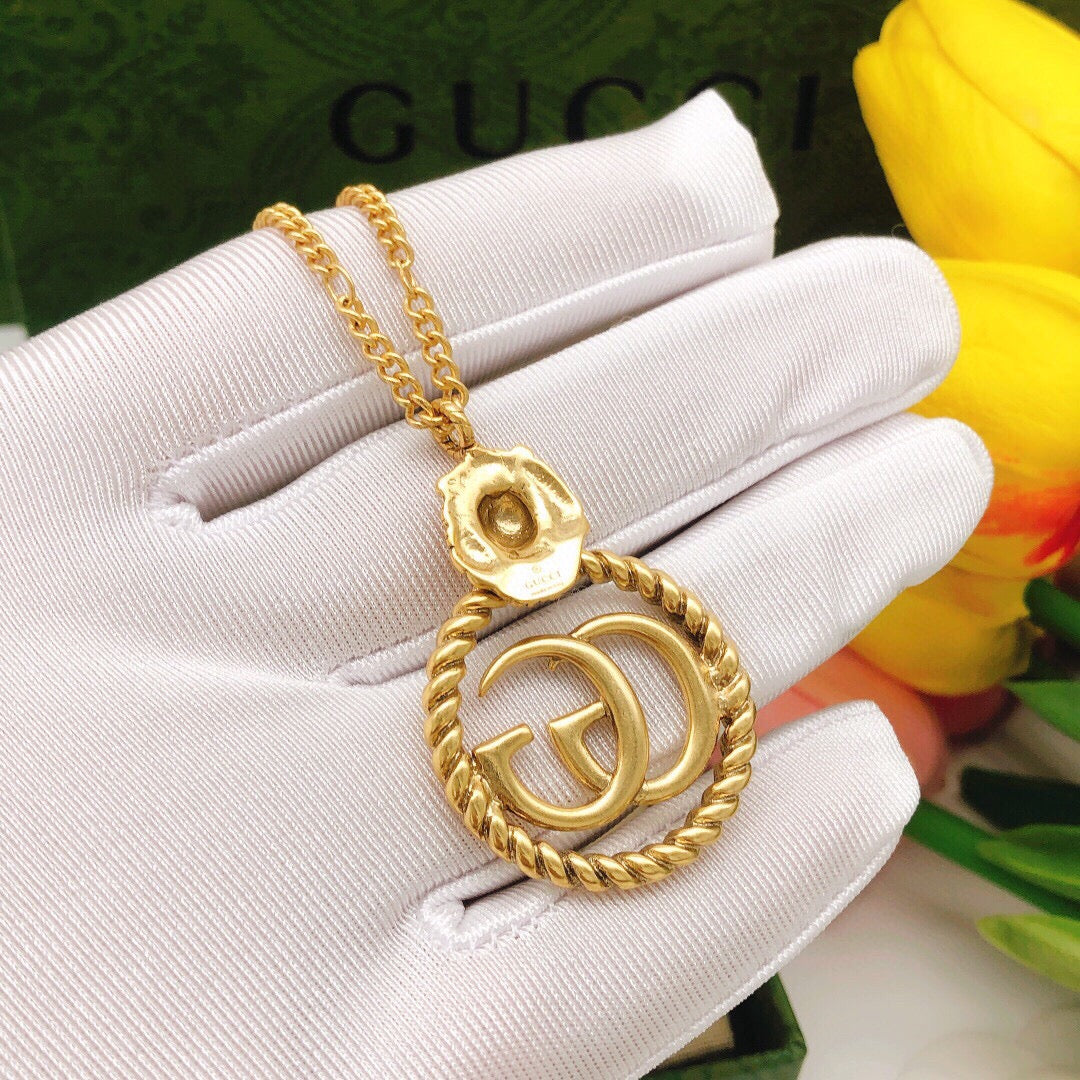 Martin Graham pendant necklace in polished metal-tone – detail view