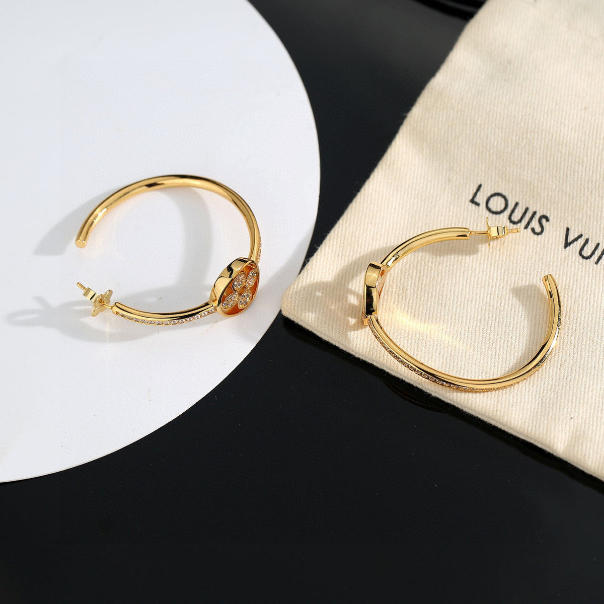 Martin Graham stud earrings in polished metal-tone – detail view