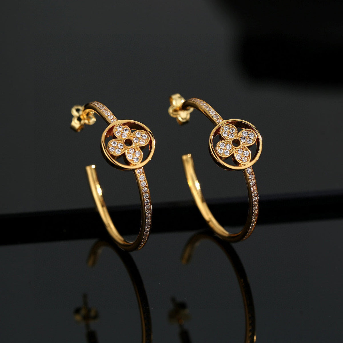 Martin Graham stud earrings in polished metal-tone – styled product view