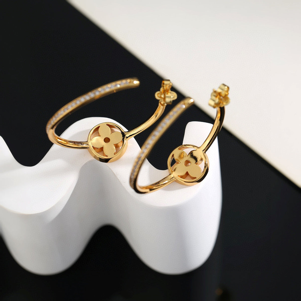 Martin Graham stud earrings in polished metal-tone – side detail