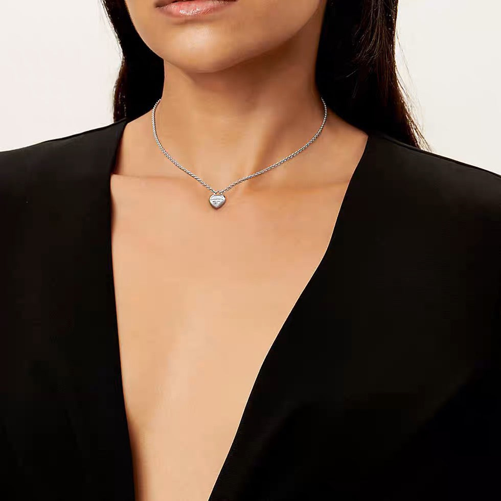 Martin Graham pendant necklace in polished metal-tone – close-up detail