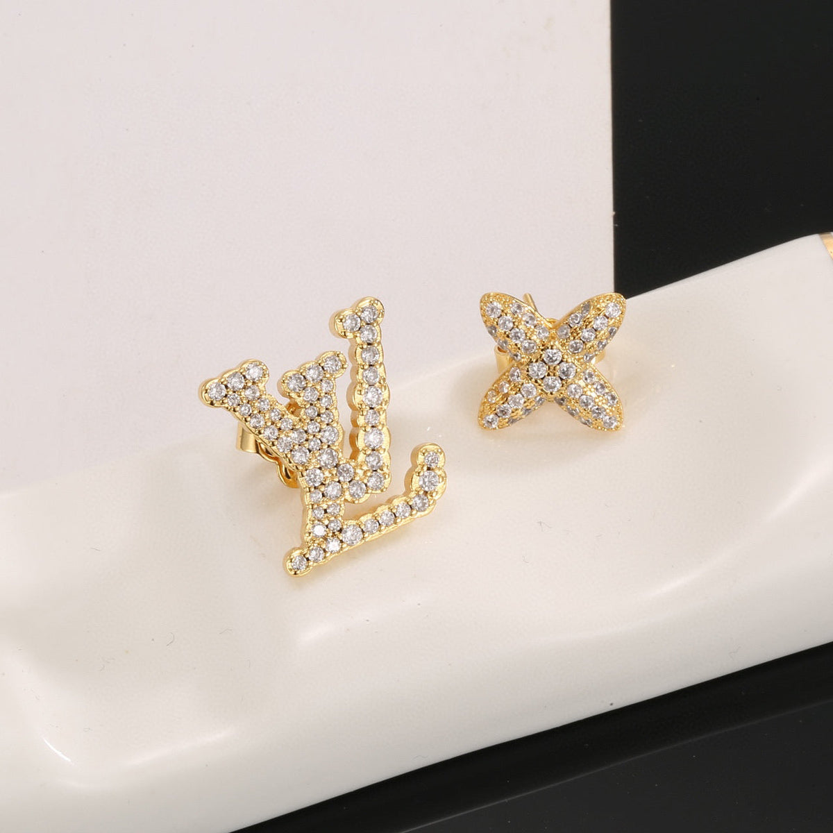 Martin Graham stud earrings in polished metal-tone – styled product view