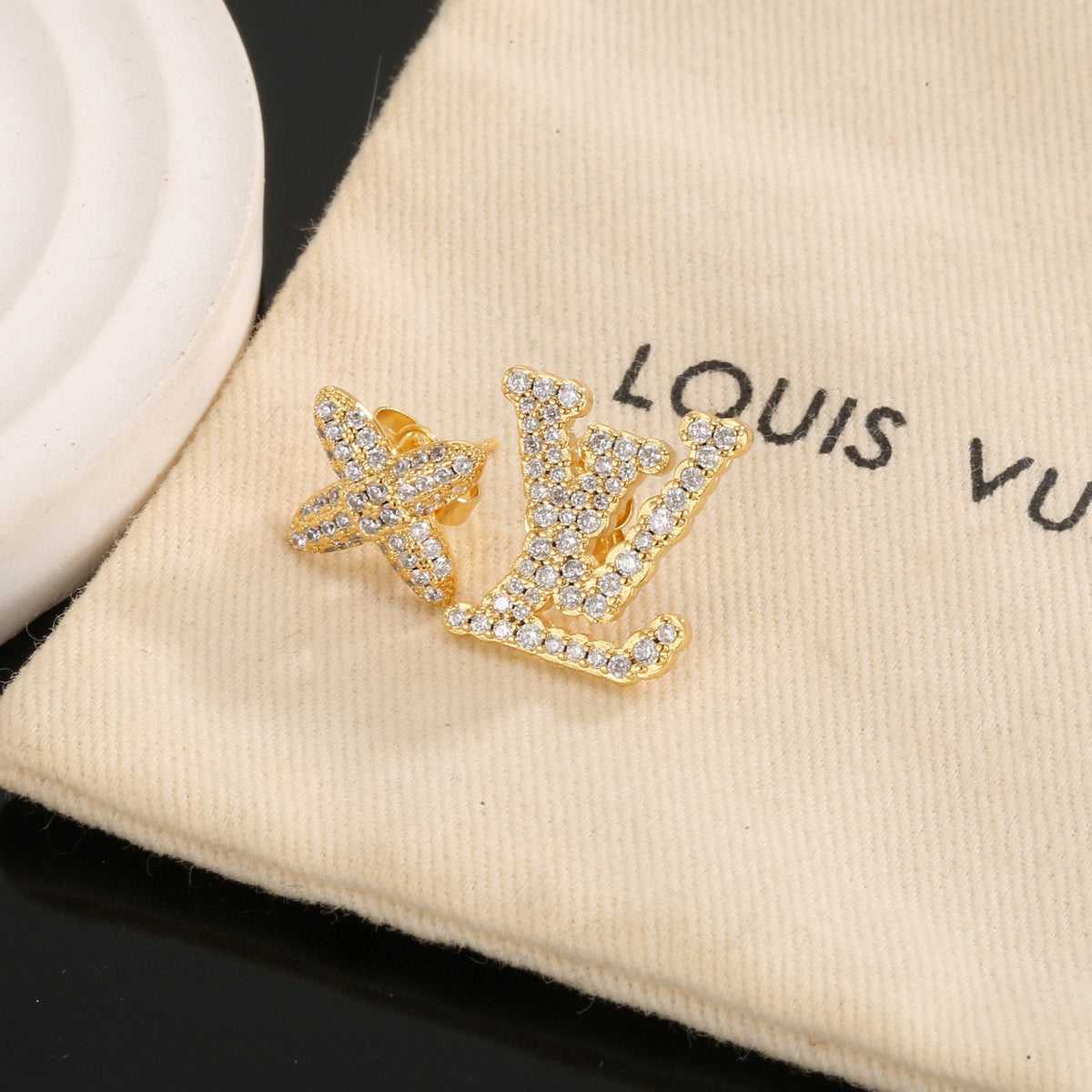 Martin Graham stud earrings in polished metal-tone – front product view