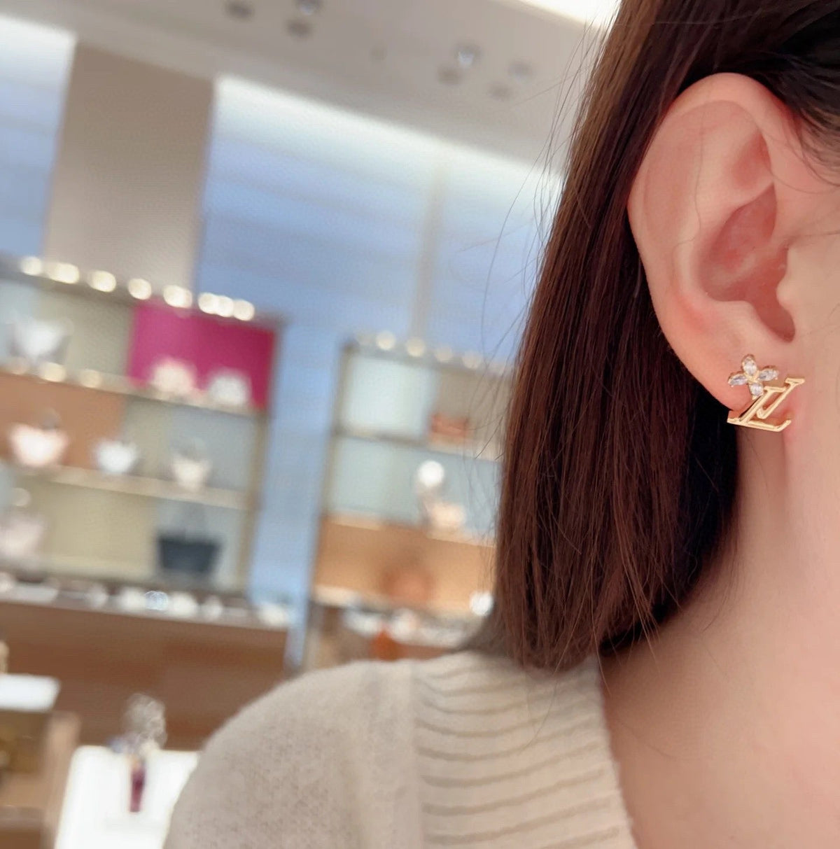 Martin Graham stud earrings in polished metal-tone – detail view