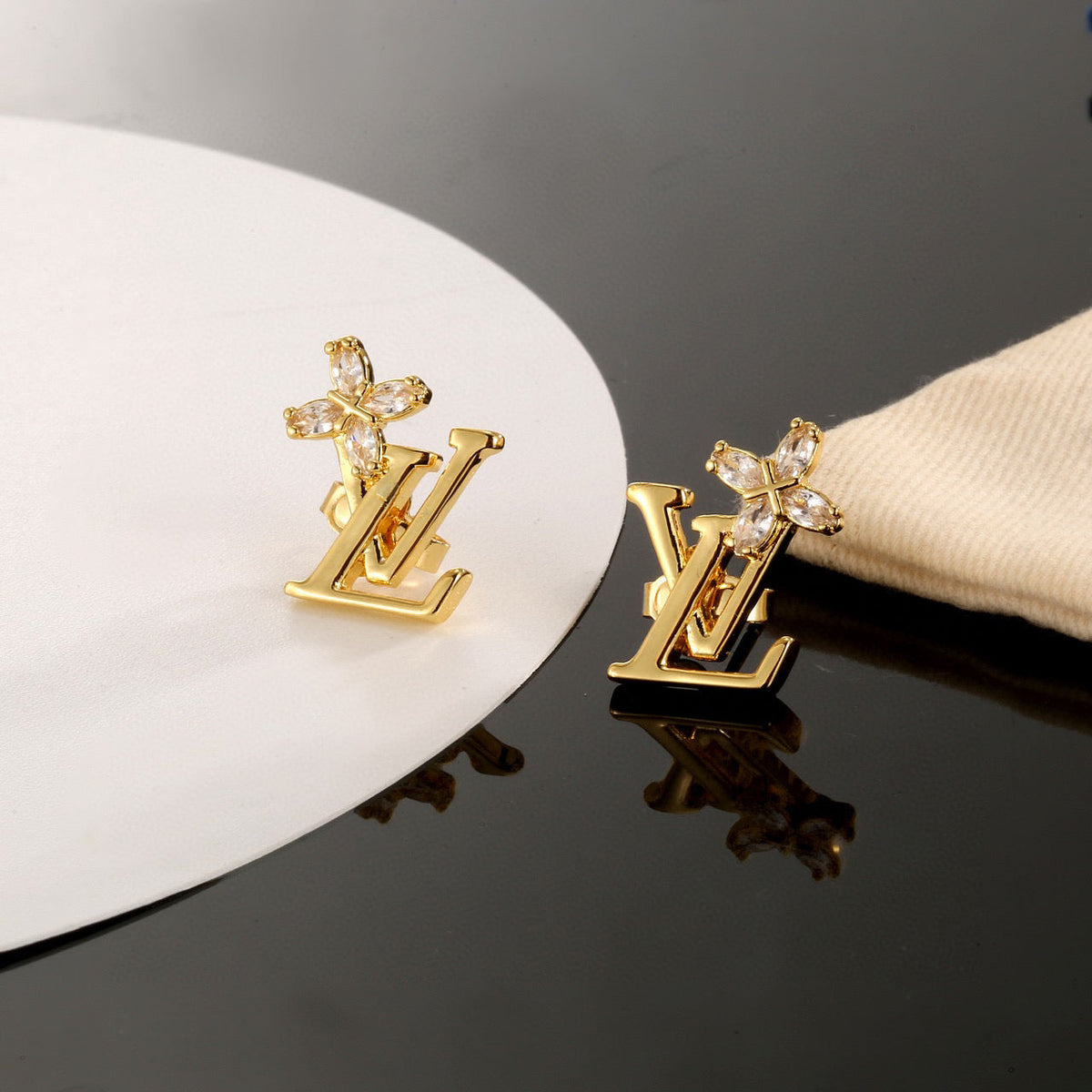Martin Graham stud earrings in polished metal-tone – main product view