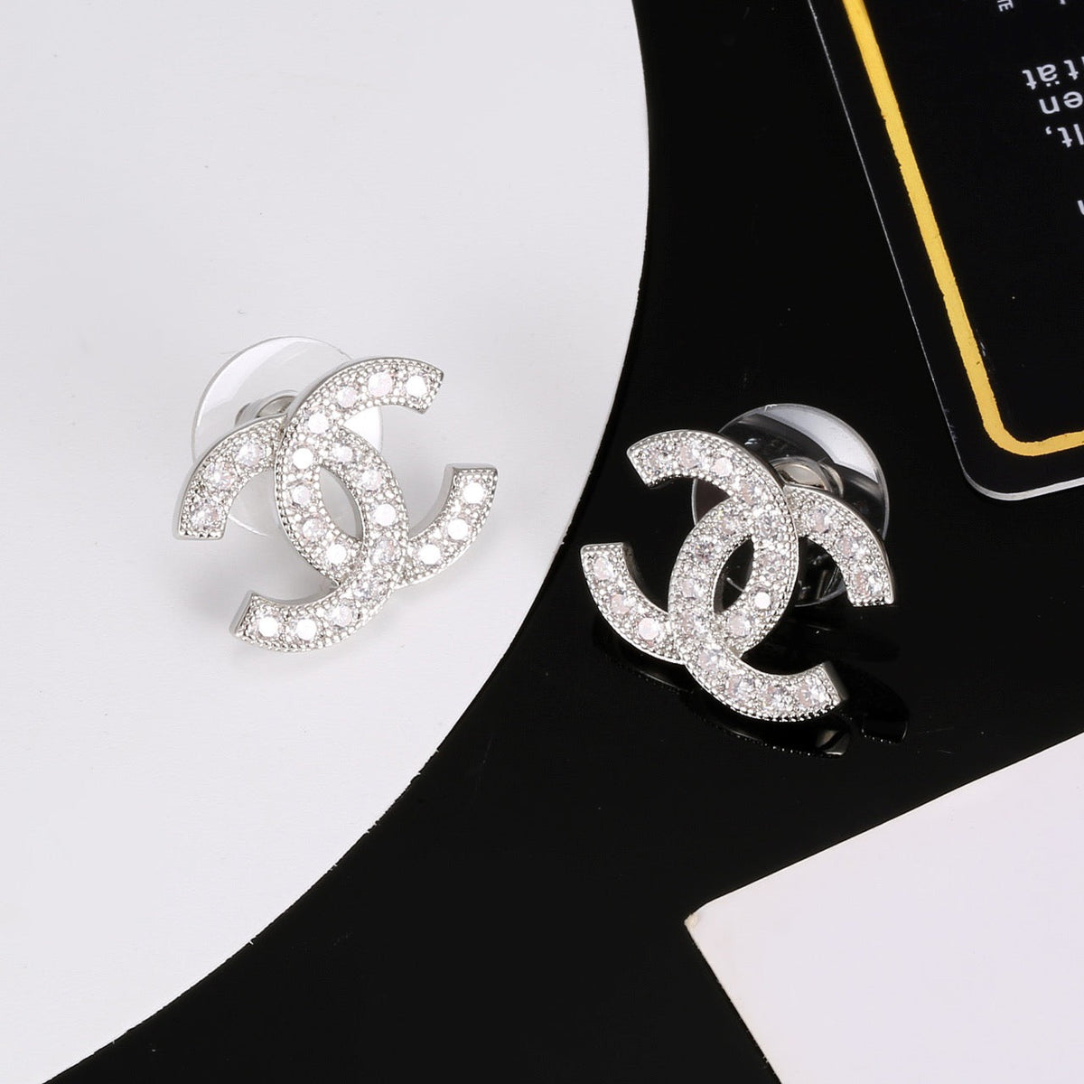 Martin Graham stud earrings in polished metal-tone – detail view