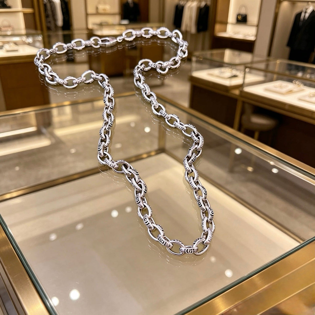 Martin Graham pendant necklace in polished metal-tone – close-up detail