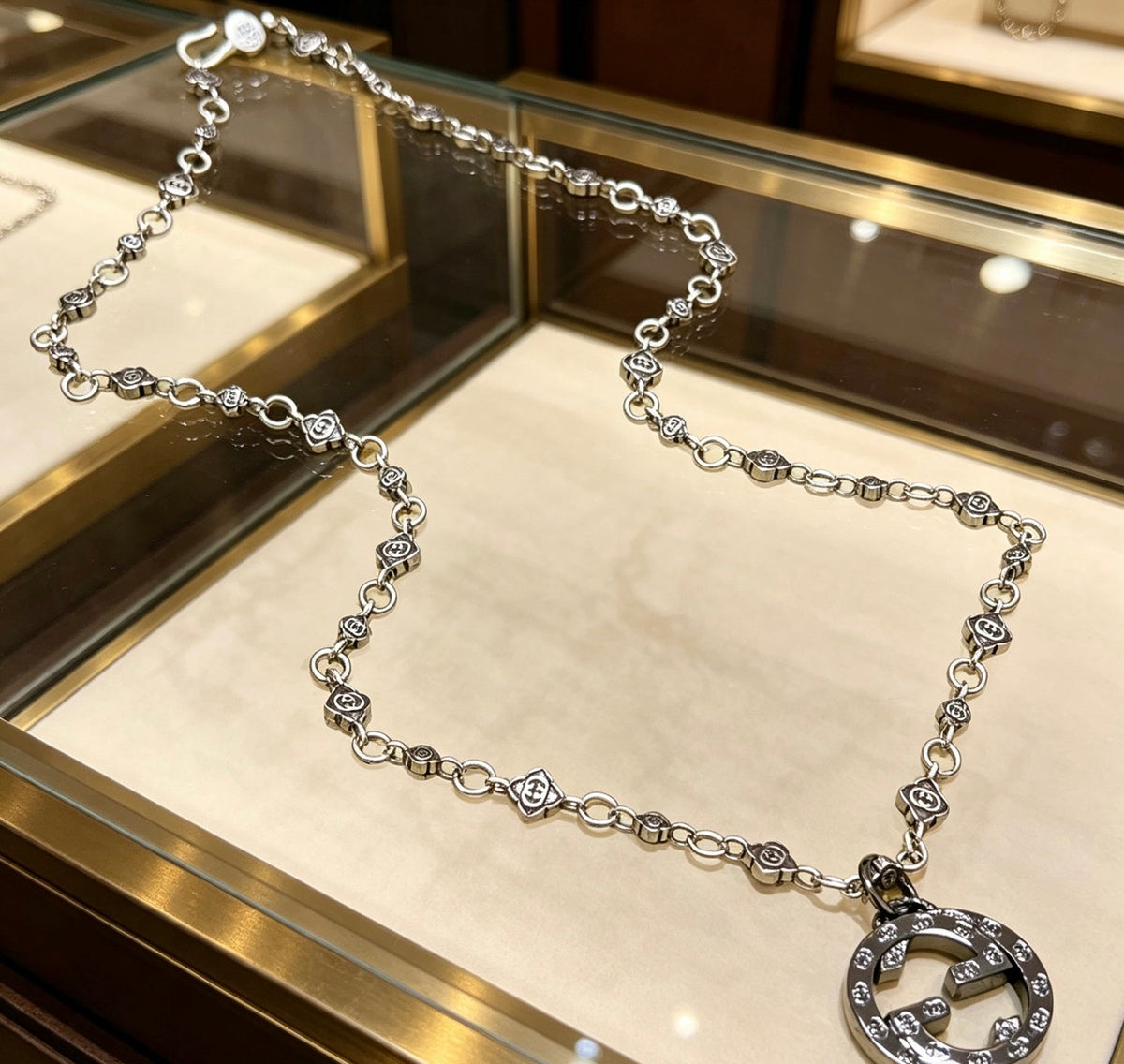 Martin Graham pendant necklace in polished metal-tone – front product view