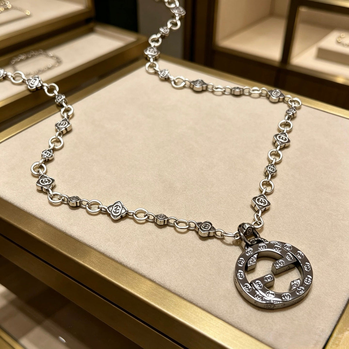 Martin Graham pendant necklace in polished metal-tone – front product view