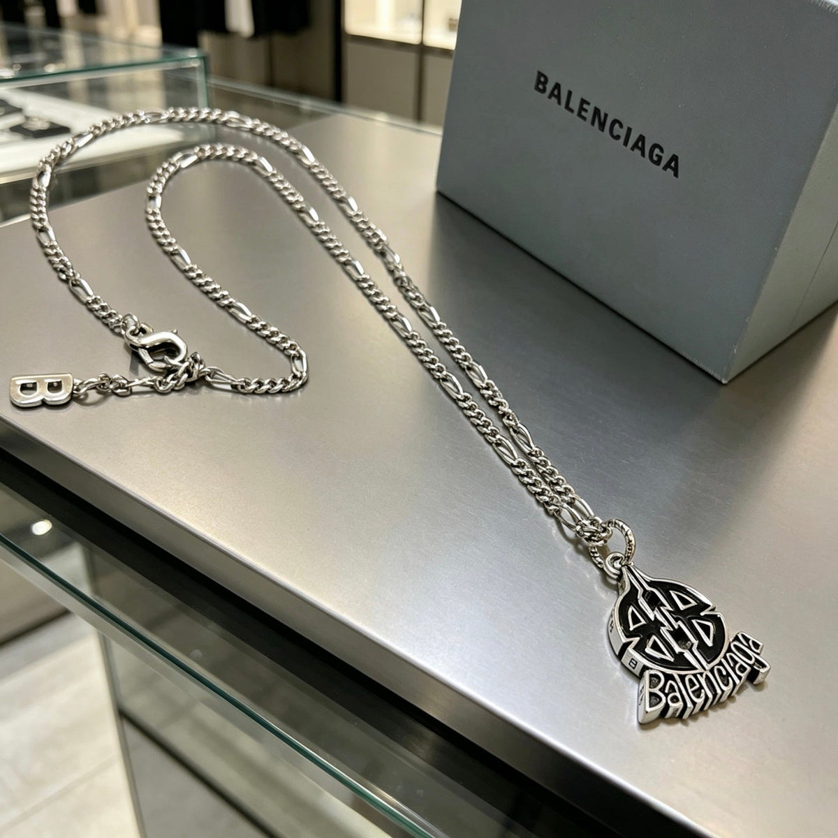 Martin Graham pendant necklace in polished metal-tone – close-up detail