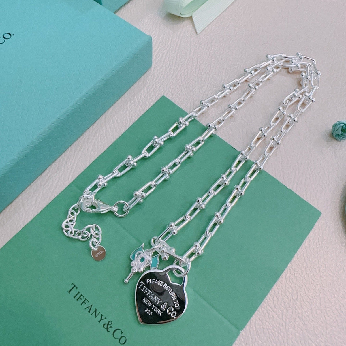 Martin Graham pendant necklace in polished metal-tone – close-up detail