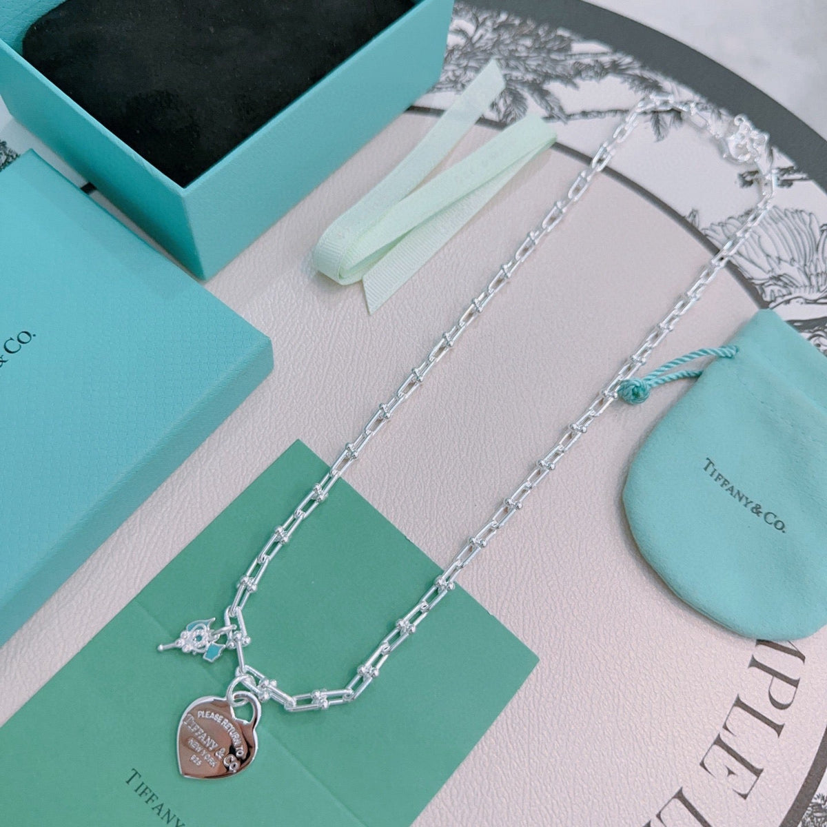 Martin Graham pendant necklace in polished metal-tone – detail view