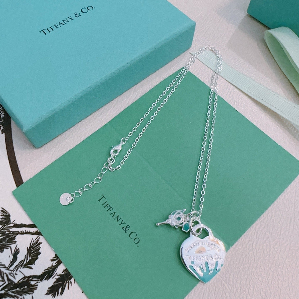 Martin Graham pendant necklace in polished metal-tone – side detail