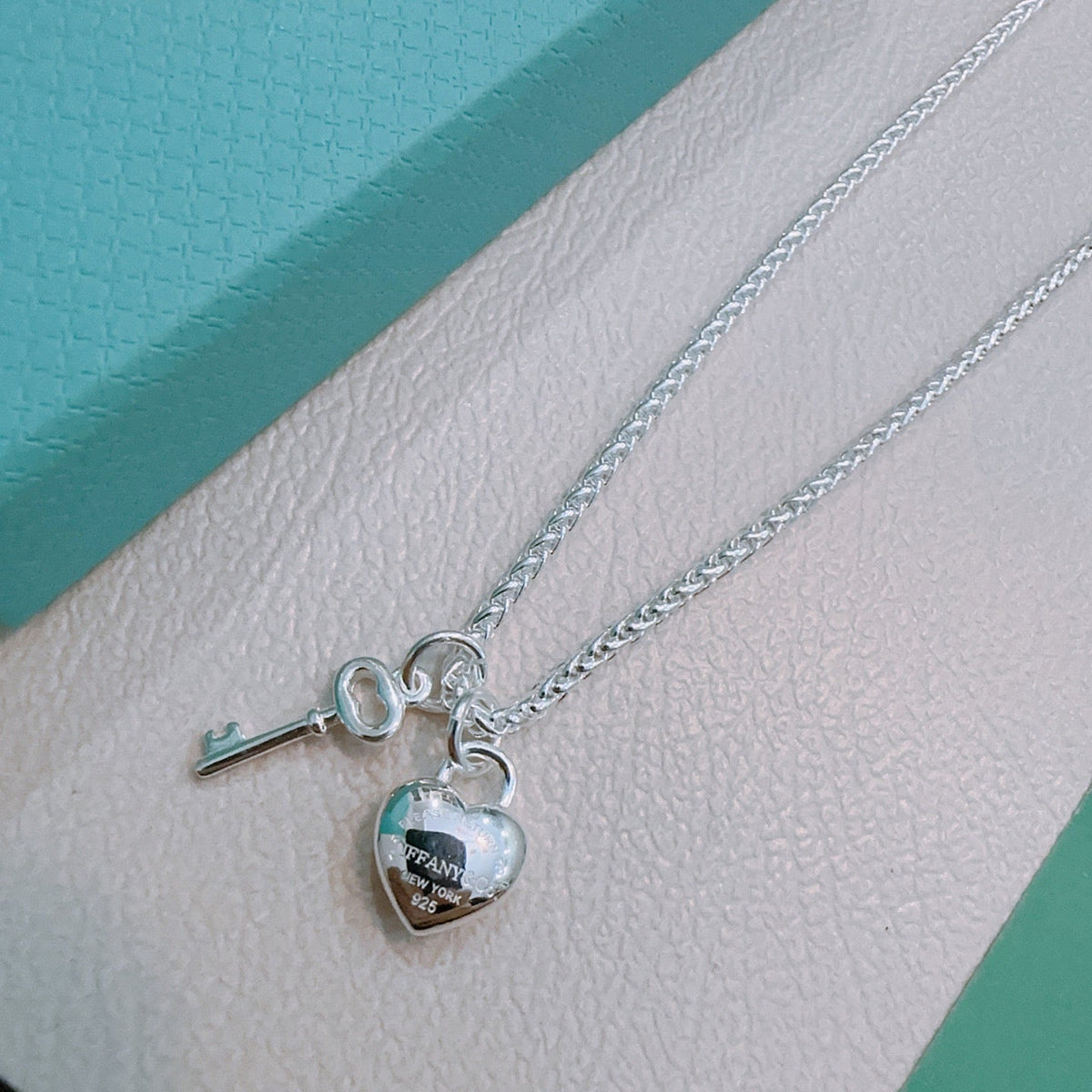 Martin Graham pendant necklace in polished metal-tone – close-up detail