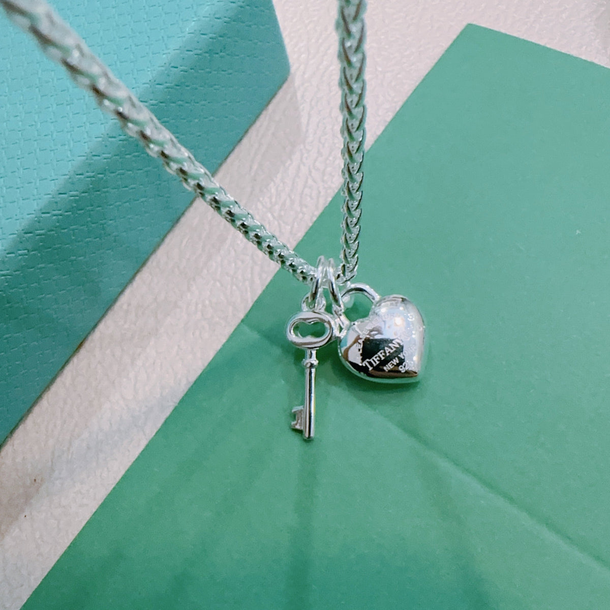 Martin Graham pendant necklace in polished metal-tone – side detail