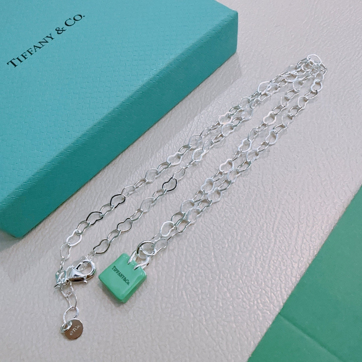 Martin Graham pendant necklace in polished metal-tone – detail view
