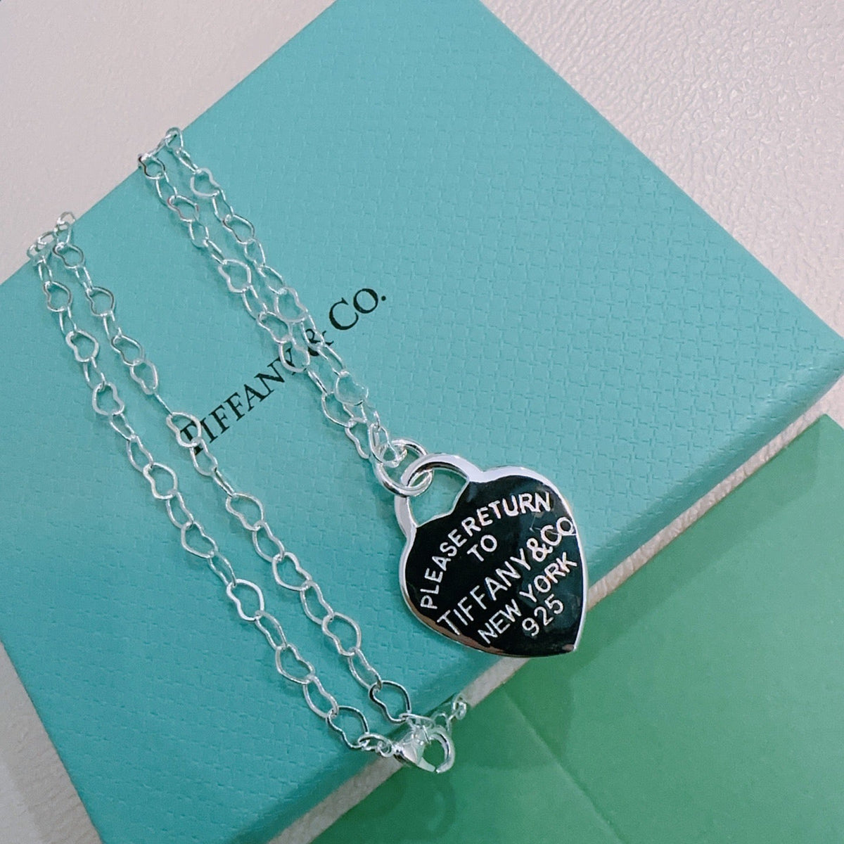 Martin Graham pendant necklace in polished metal-tone – side detail