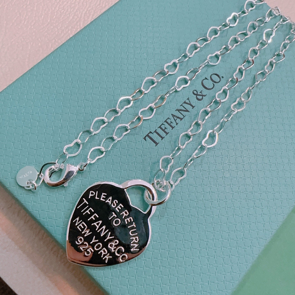 Martin Graham pendant necklace in polished metal-tone – close-up detail