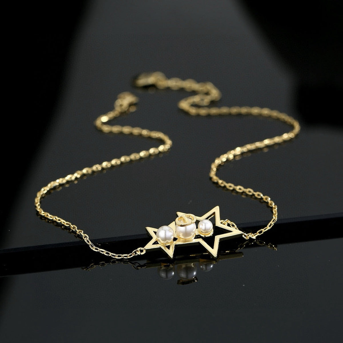 Martin Graham pendant necklace in polished metal-tone – detail view