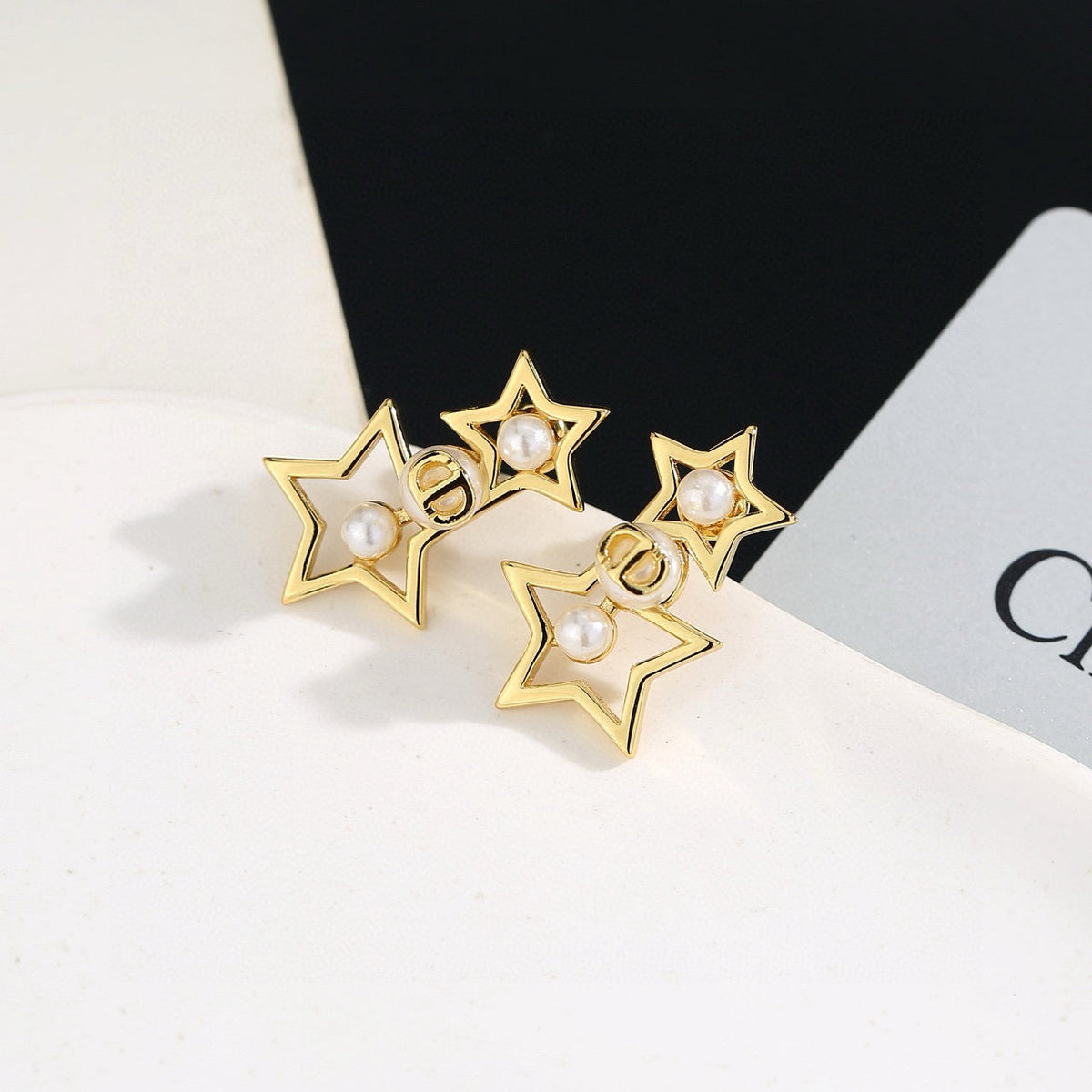 Martin Graham stud earrings in polished metal-tone – front view