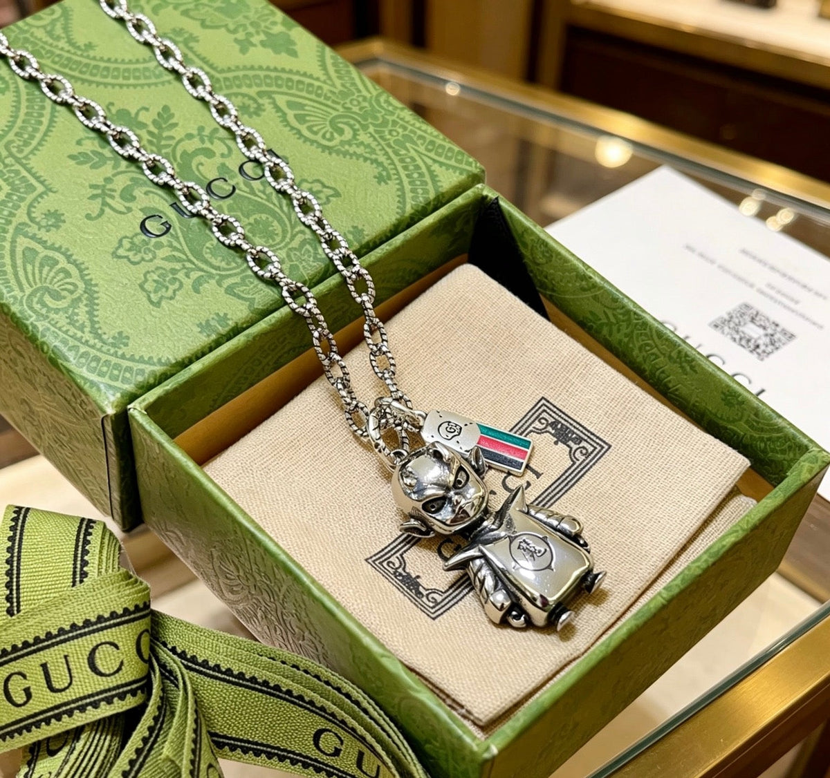 Martin Graham pendant necklace in polished metal-tone – close-up detail