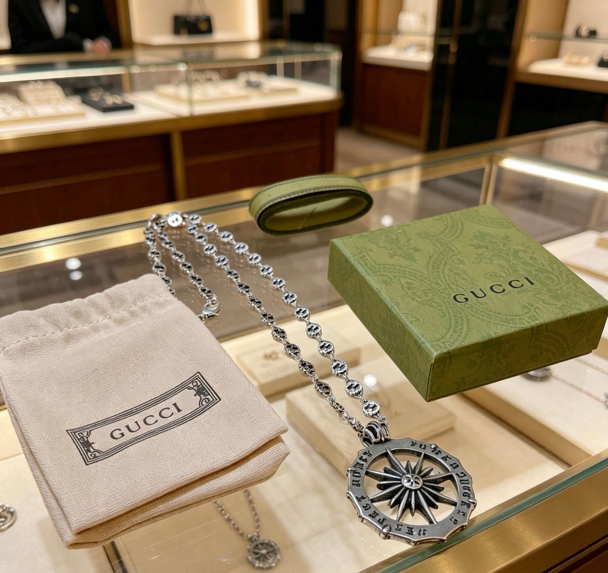 Martin Graham pendant necklace in polished metal-tone – close-up detail