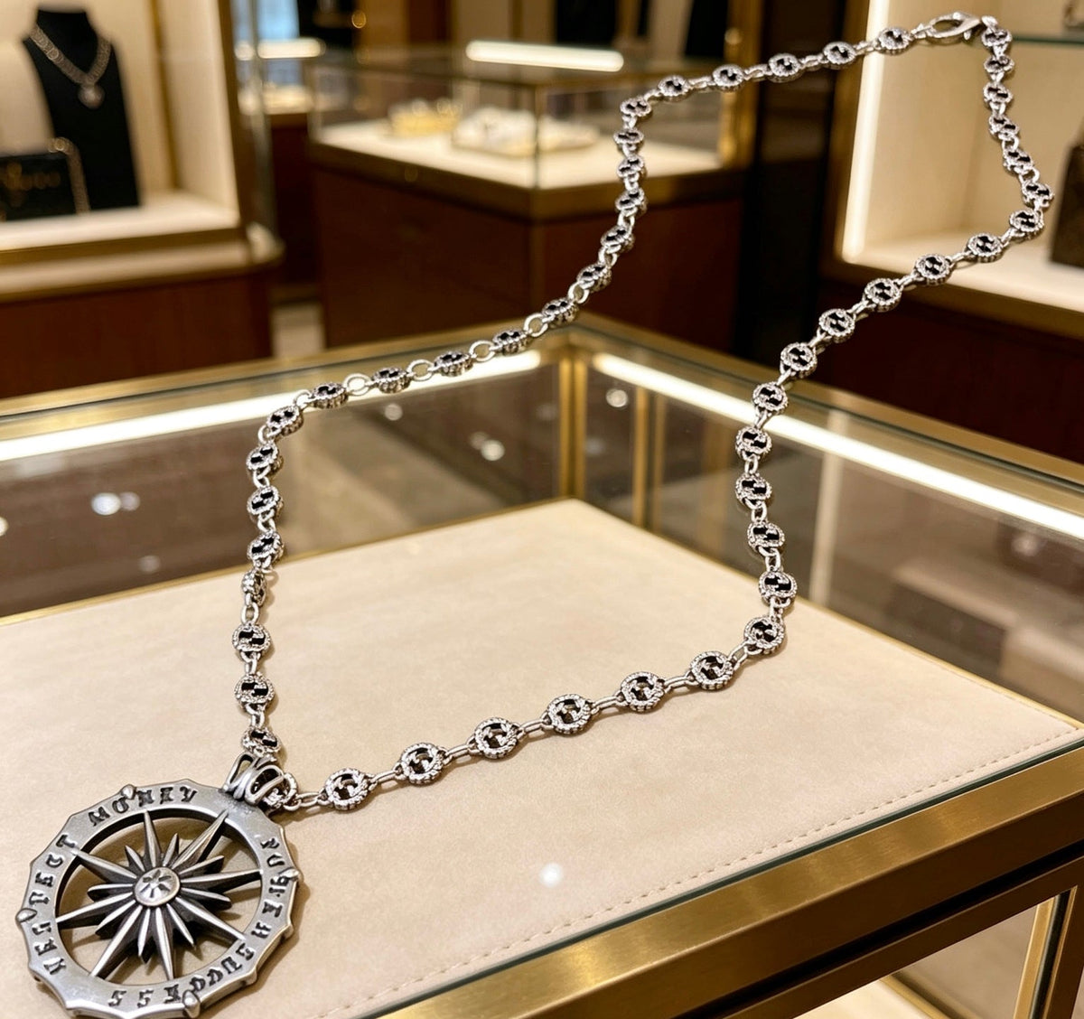 Martin Graham pendant necklace in polished metal-tone – side detail