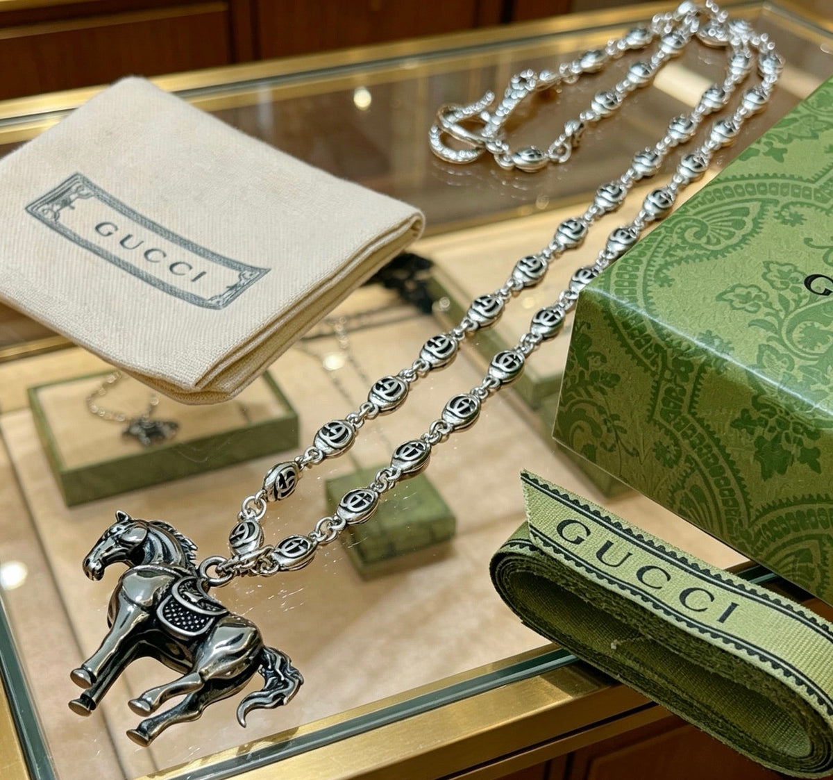 Martin Graham pendant necklace in polished metal-tone – front product view